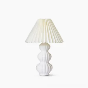 Luna pleated ceramic table lamp with white glazed base and natural beige pleated fabric shade, mid-century modern design