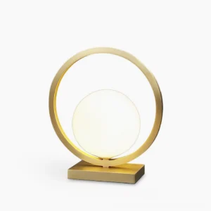 Lunar Brass Table Lamp with frosted white glass globe and circular brass frame on white background