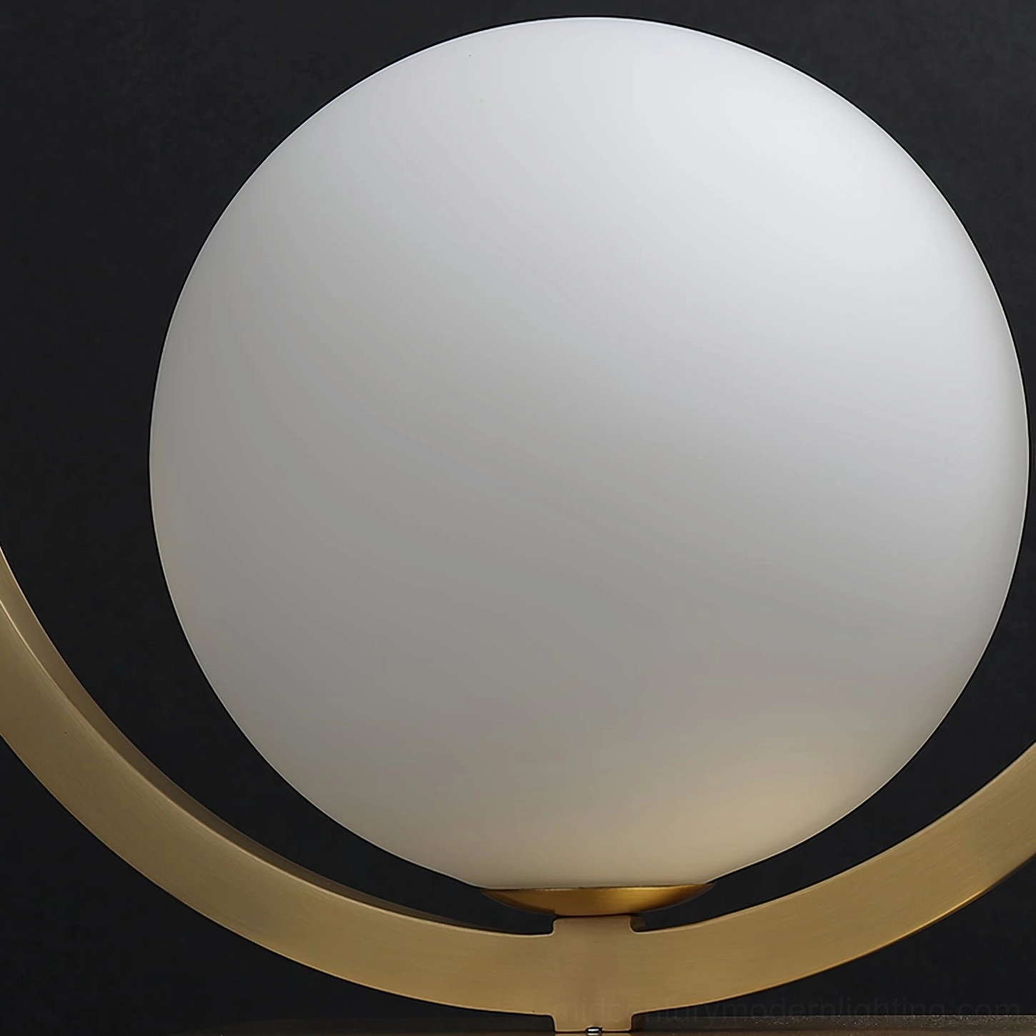 Close-up detail of Lunar Table Lamp frosted white glass globe with brushed gold metal ring frame