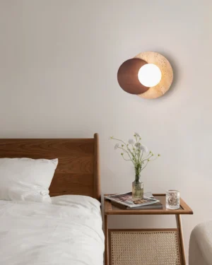 Lunar Eclipse wall sconce warm ambient lighting in modern master bedroom with wooden bed frame