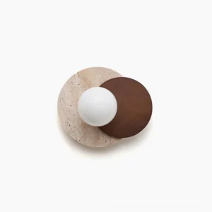 Lunar Eclipse wall sconce dual-sphere design with frosted glass and travertine base - studio flat lay view