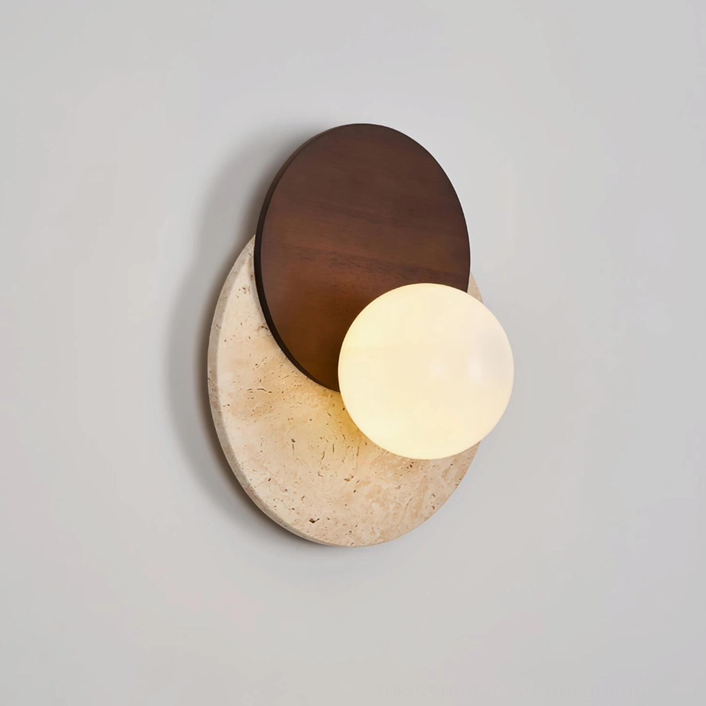 Lunar Eclipse sconce lit glowing frosted glass warm ambient light illumination effect