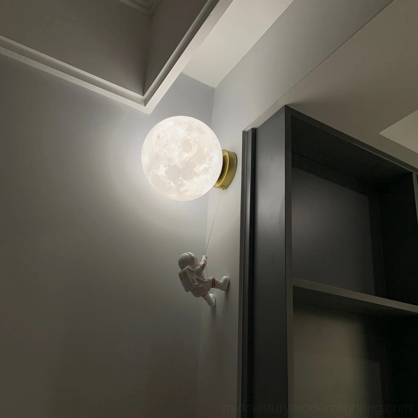 Lunar globe wall lamp in three-quarter view showing complete design and shadow casting