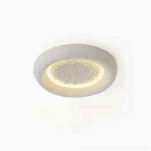 Lunar Glow LED ceiling lamp with textured moon crater surface and warm annular LED backlight, top-down studio view