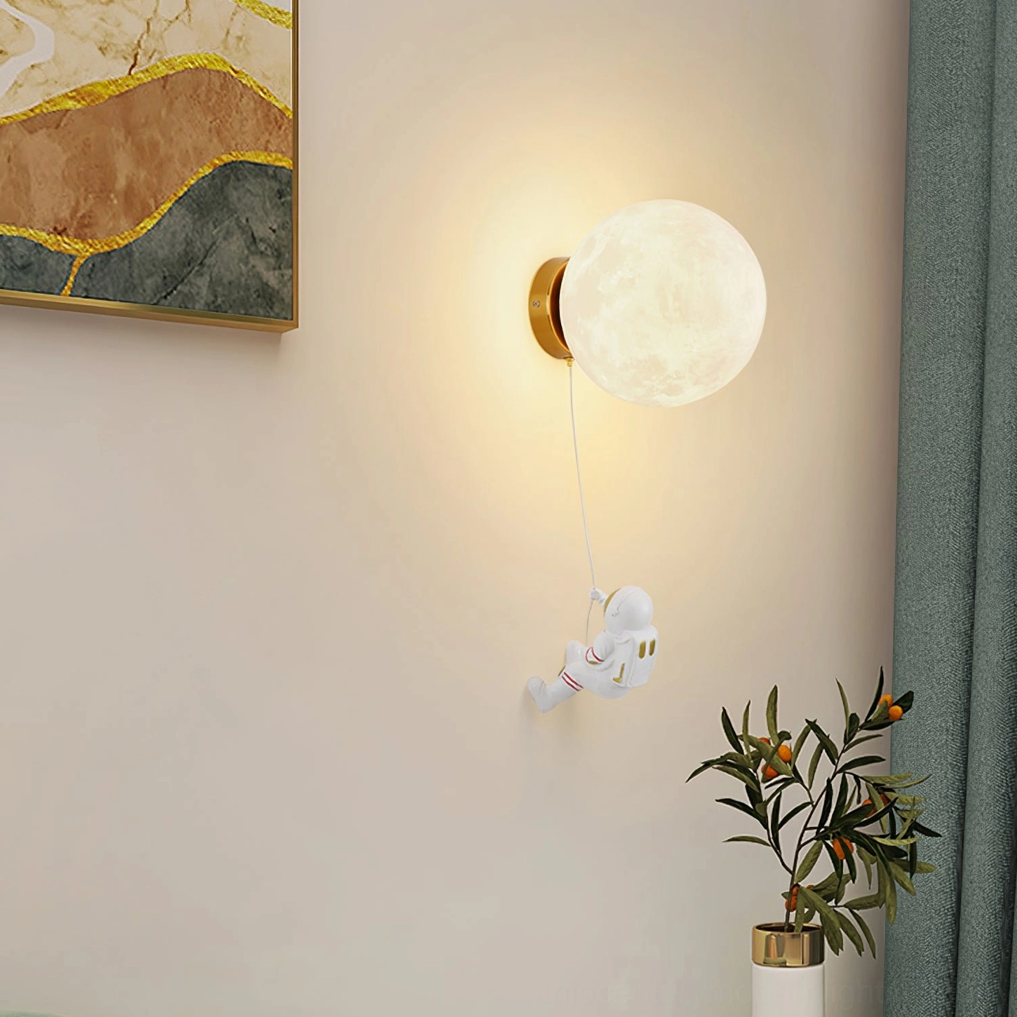 Lunar wall lamp paired with celestial and astronomy themed home decor