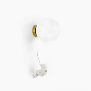 Lunar Wall Lamp with astronaut resin decoration - white globe sconce on studio background