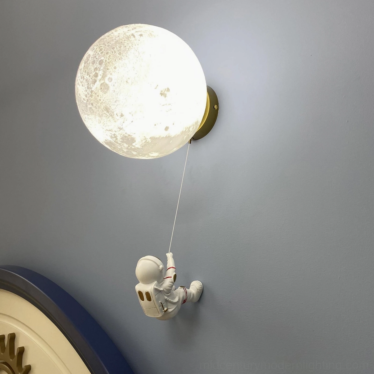 Lunar wall lamp in contemporary bedroom creating serene ambiance with soft lighting