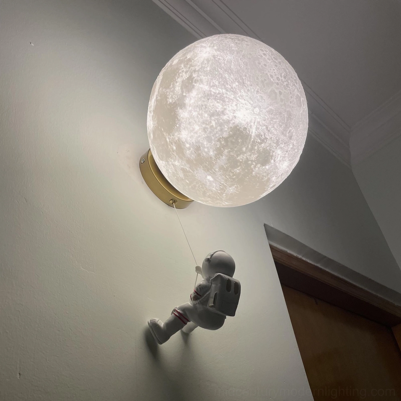 Lunar wall lamp in contemporary living room with modern furniture and minimalist decor