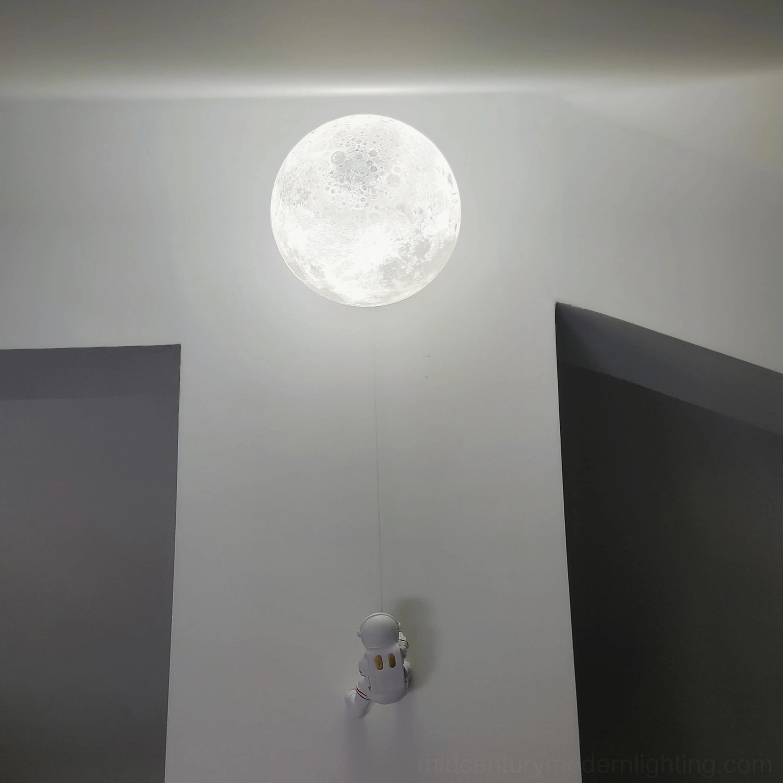 Lunar wall sconce with LED bulb providing energy-efficient cool-toned modern lighting