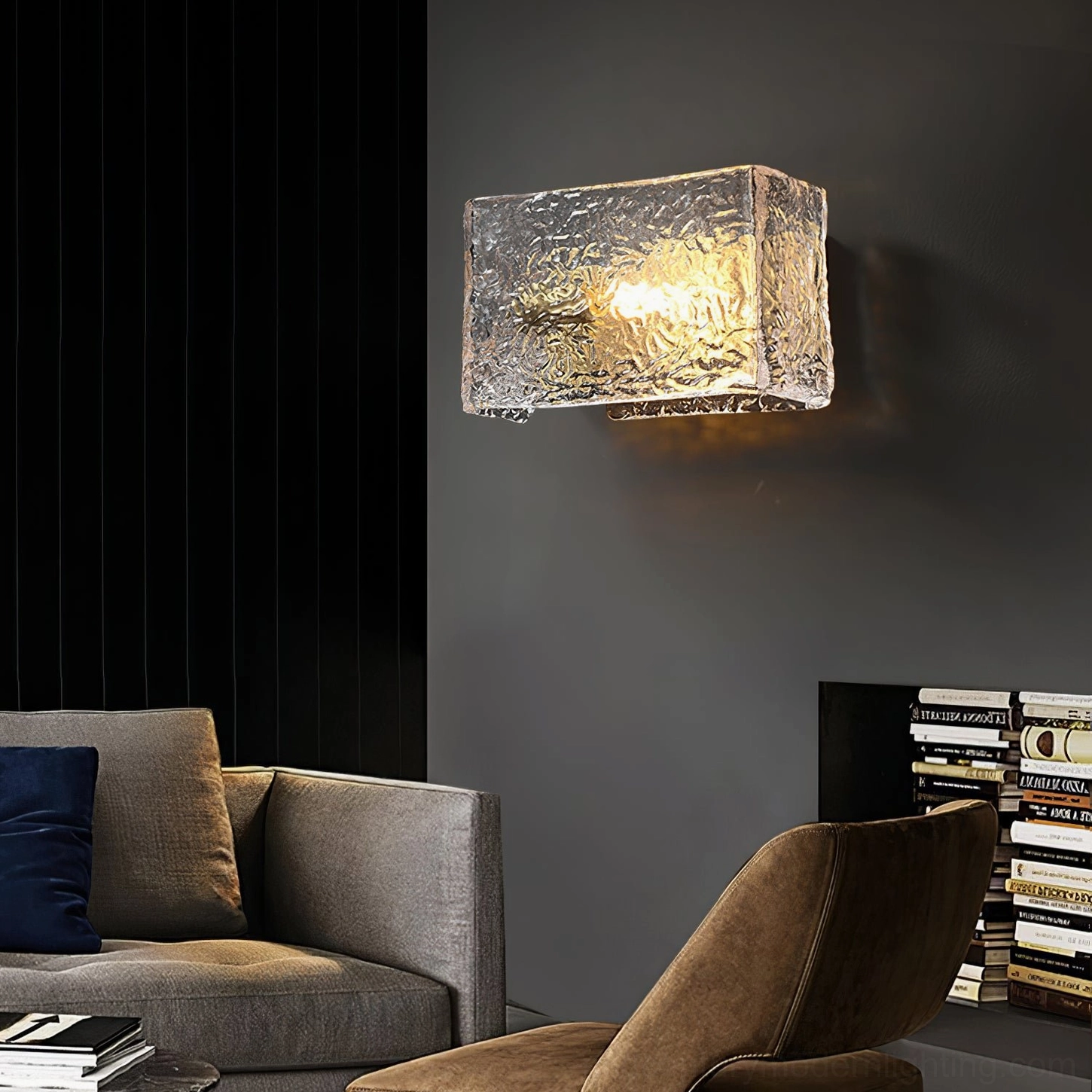 Lunea wall lamp mounted on dark grey living room wall, eye-level side view with warm ambient lighting