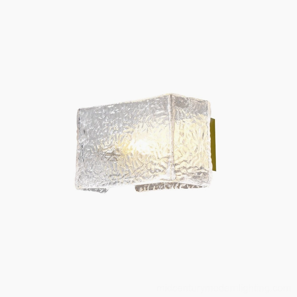 Lunea wall sconce full product shot featuring geometric brass backing plate and water-ripple glass diffuser