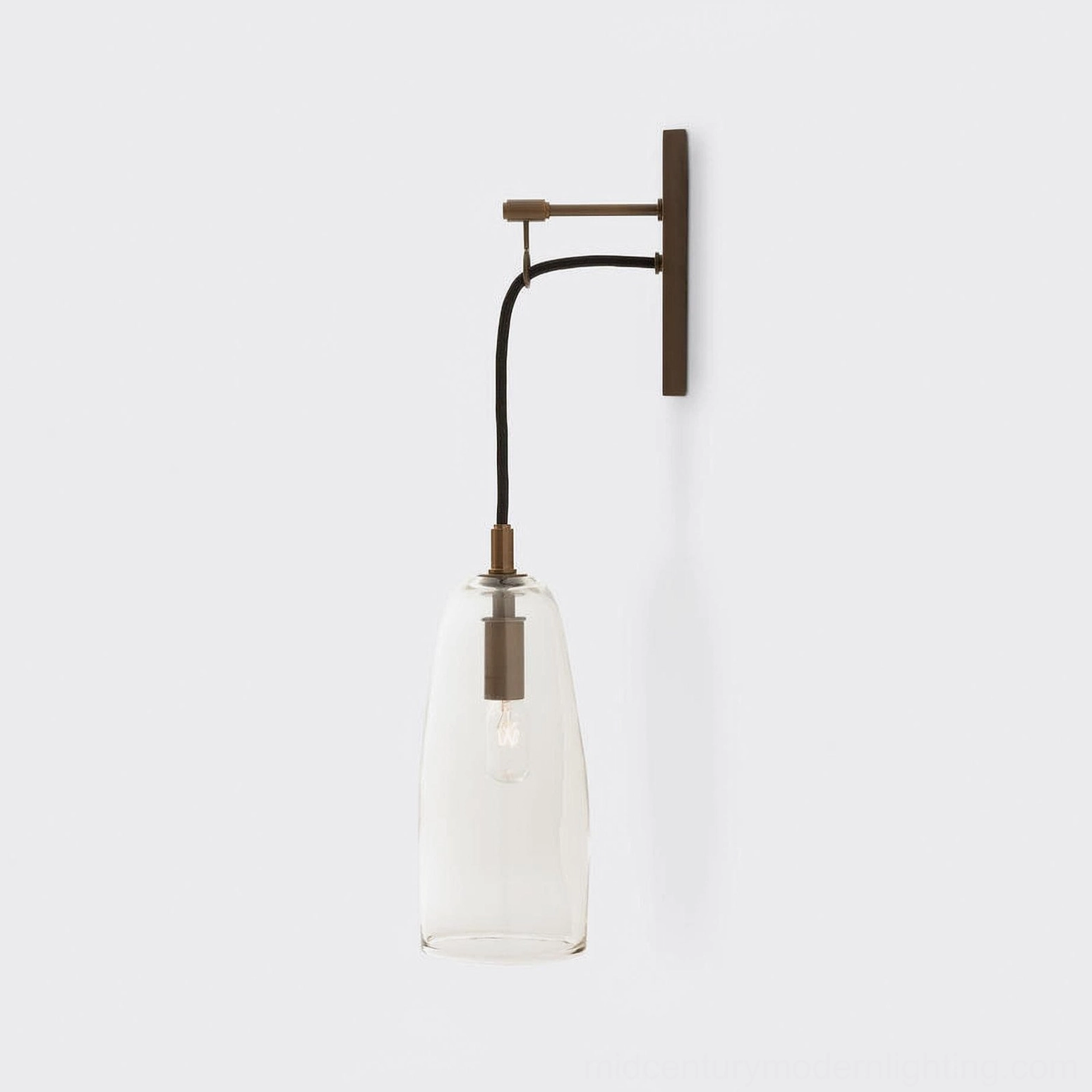 Brass wall sconce with clear glass shade, front-facing minimalist view on white background