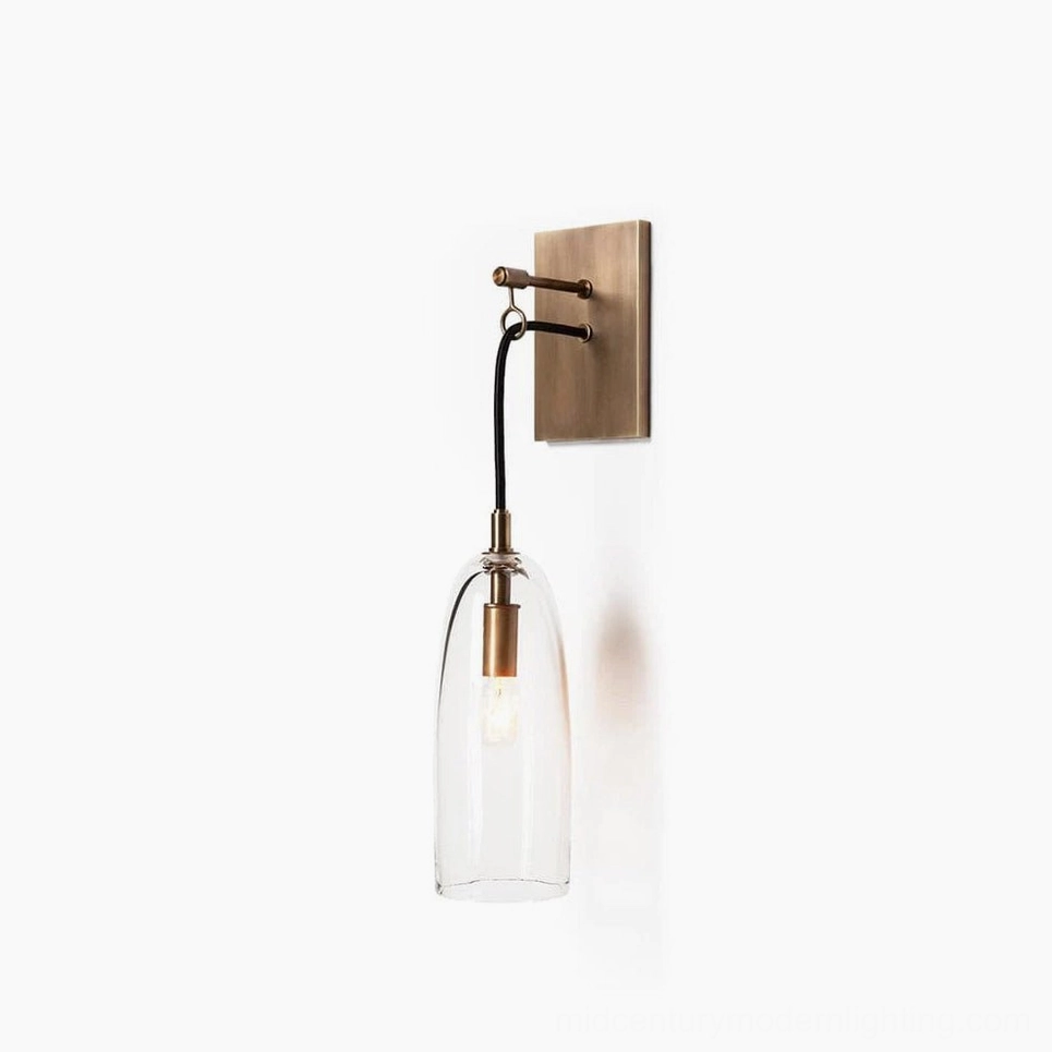Lure brass wall sconce with tapered clear glass shade, minimalist modern design on white background