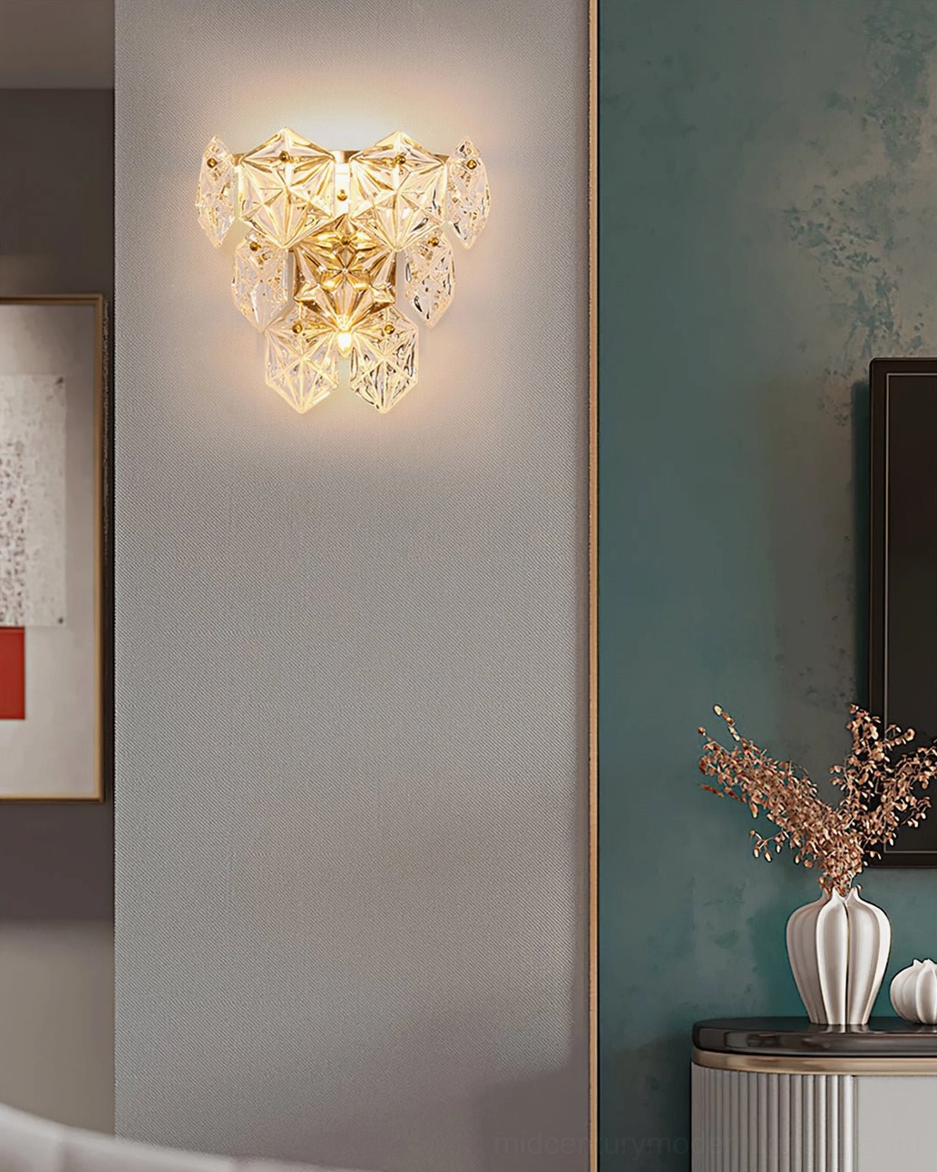 Modern crystal wall sconce in luxury home setting displaying sophisticated gold brass hardware