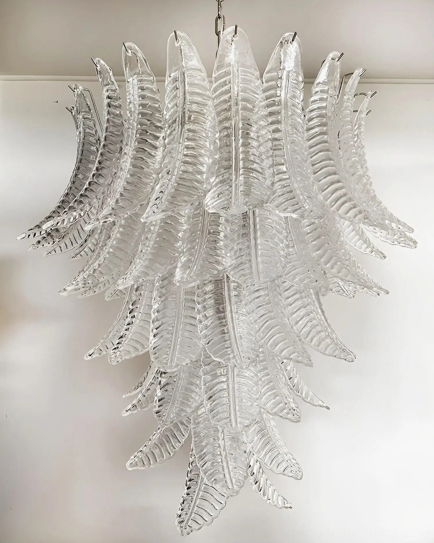 Luxury glass chandelier suspended in contemporary entryway foyer