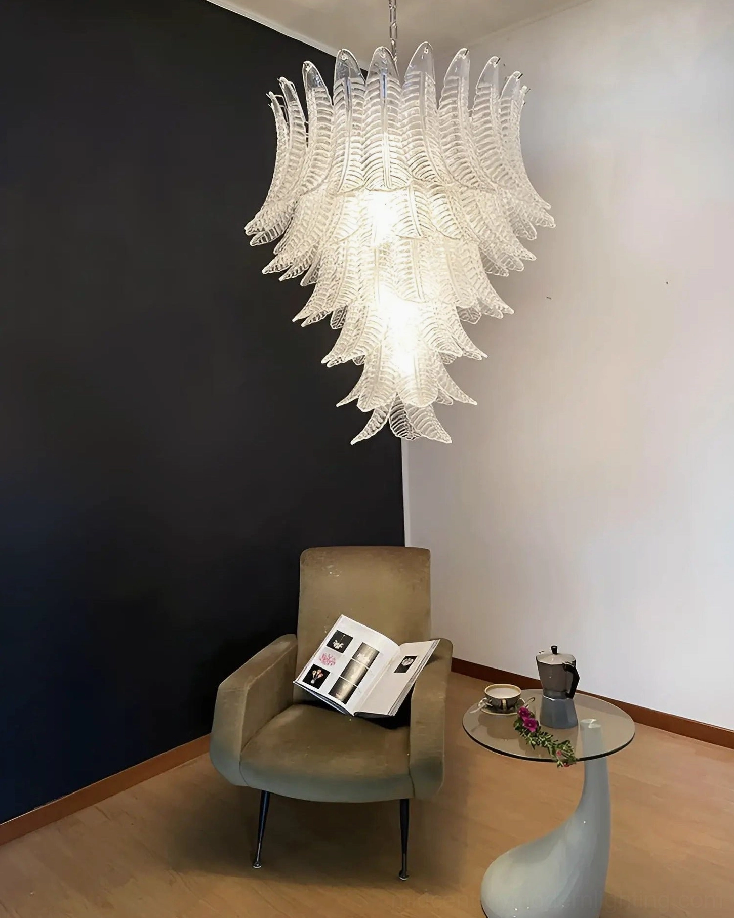 Luxury pink palm leaf chandelier installed in sophisticated dining space atmosphere