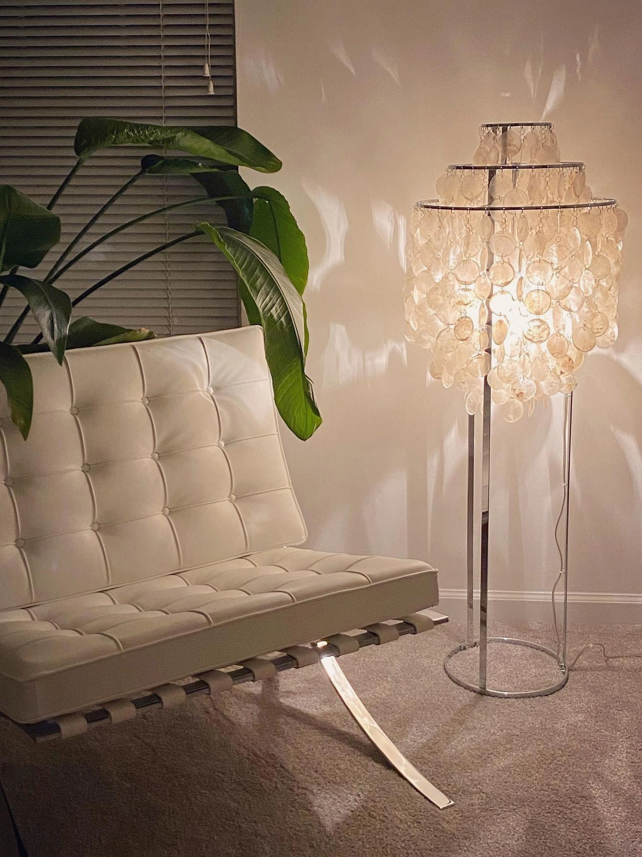 Contemporary shell floor lamp in luxury residential lobby or boutique hotel setting
