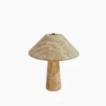 Lydia travertine table lamp front view with mushroom silhouette and brass crown detail on white background