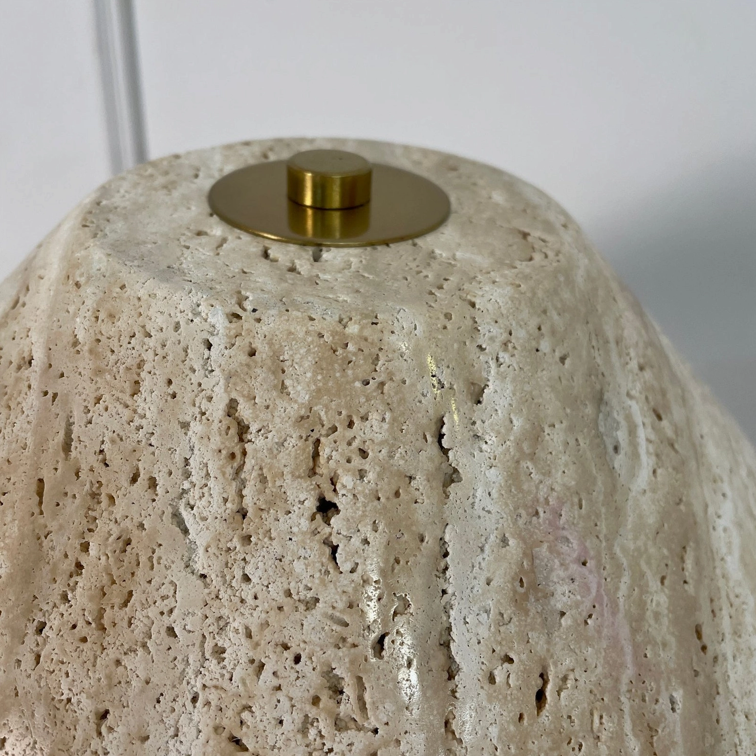 Lydia stone lamp styled on decorative table with complementary home accessories and botanical elements
