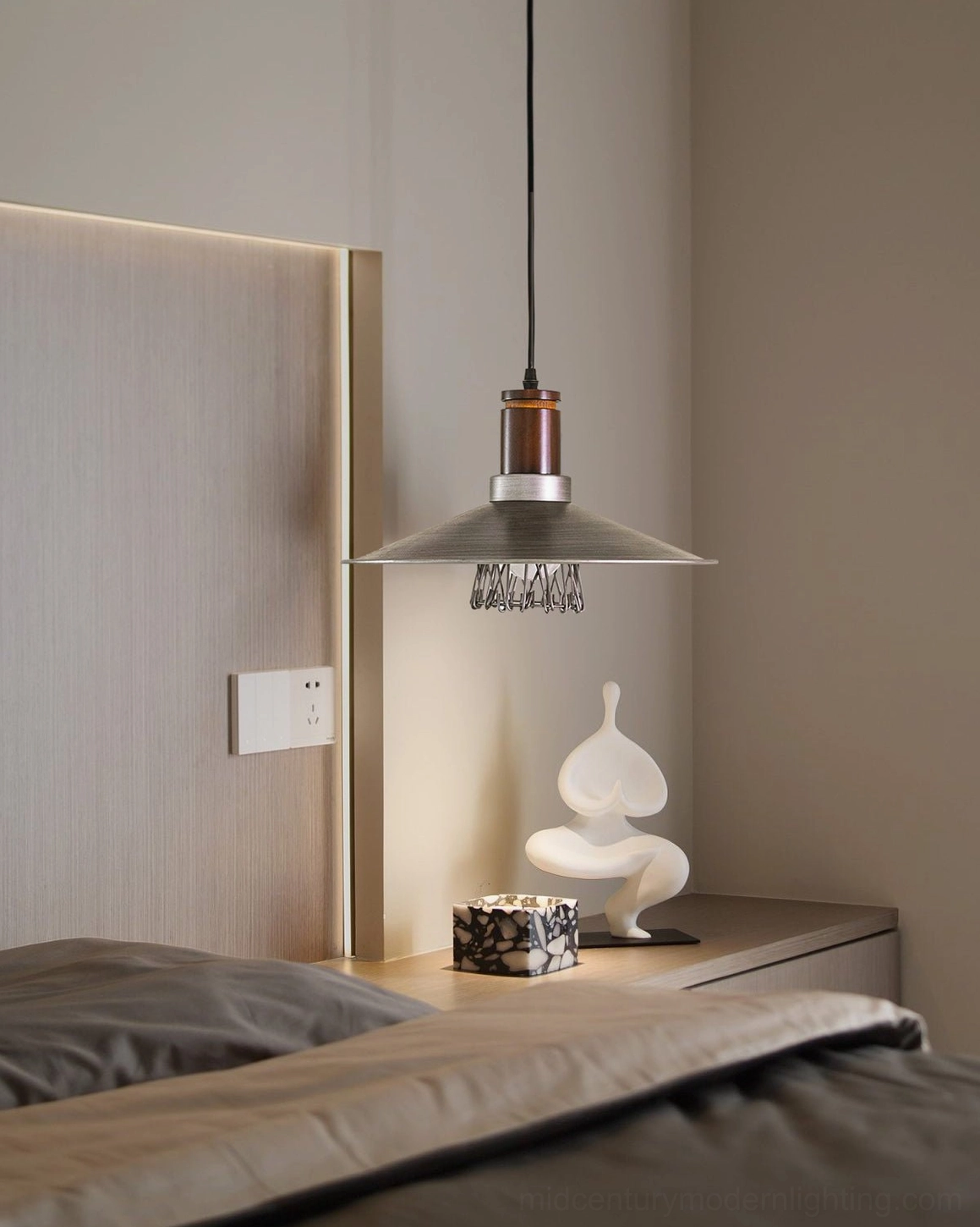 Lyfa industrial pendant light hung above nightstand in bedroom corner with warm industrial style decor