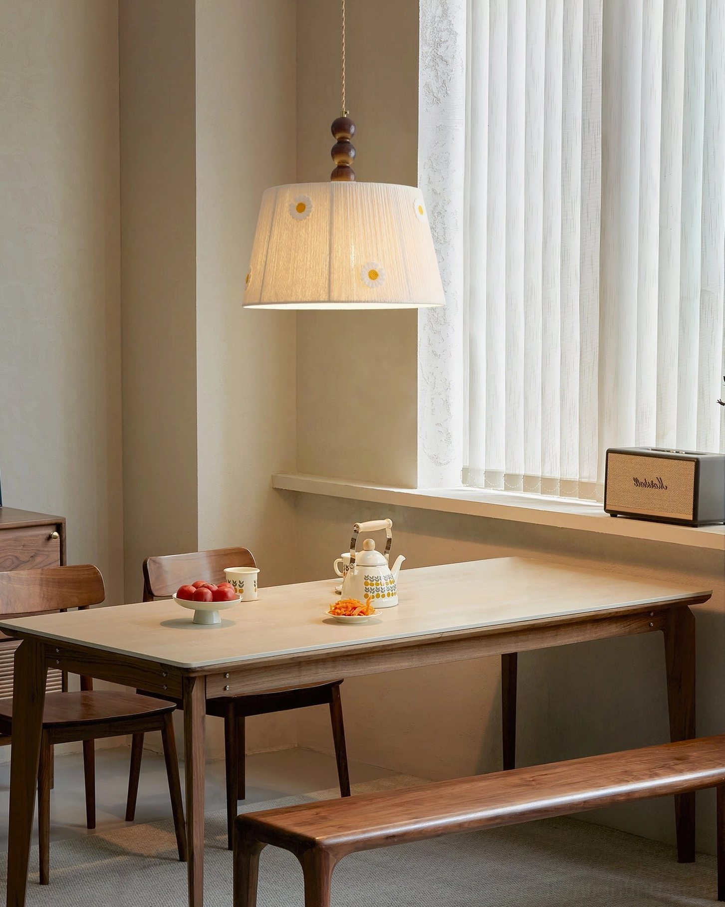 Lytham daisy embroidered pendant lamp in Nordic minimalist dining space with vertical window treatments