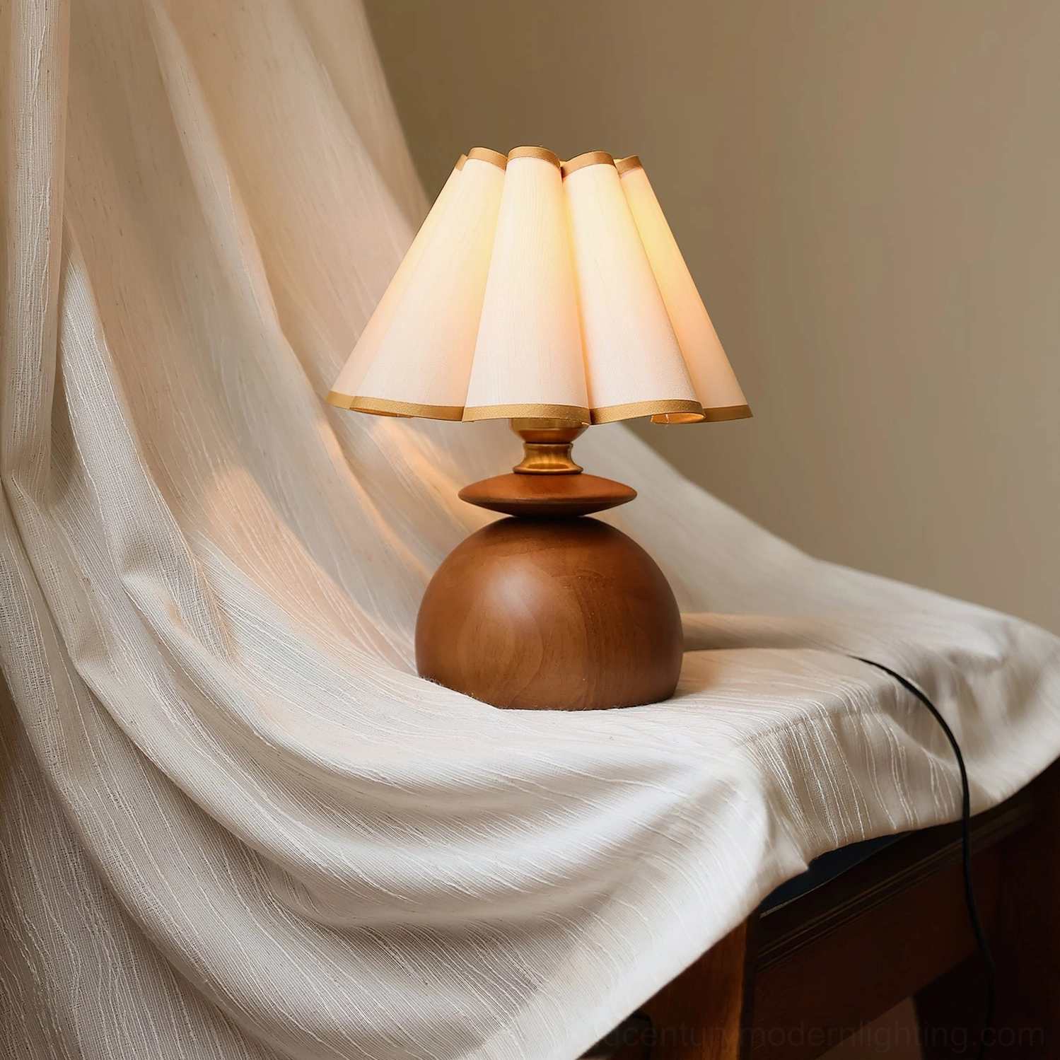 Mabel pleated table lamp side view on draped fabric furniture warm farmhouse aesthetic