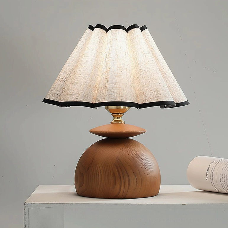 Mabel pleated table lamp white shade flat lay studio showing black-trimmed pleats and walnut wood base