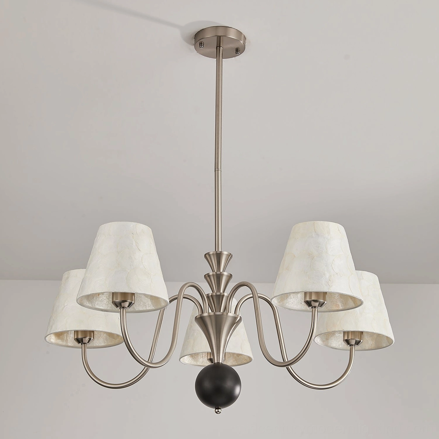 Maeve capiz shell chandelier ambient lighting installed creating warm atmospheric glow in residential space