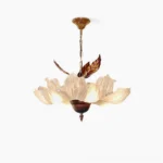 Magnolia Bloom Chandelier front view with layered ivory glass petals and bronze leaf accents on white background