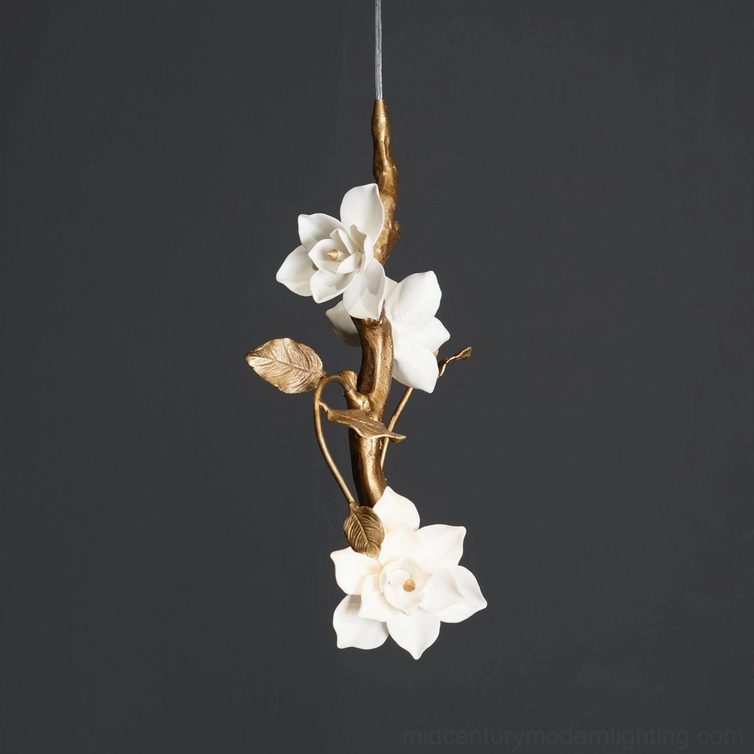 Artistic detail view of thylane magnolia pendant light with sculptural ceramic blooms and intertwining branches