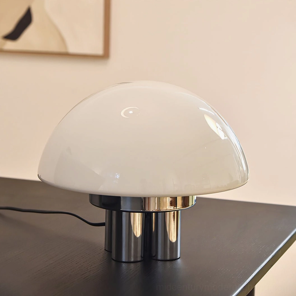 Mid-century modern mushroom lamp illuminated showing warm opal white glass glow