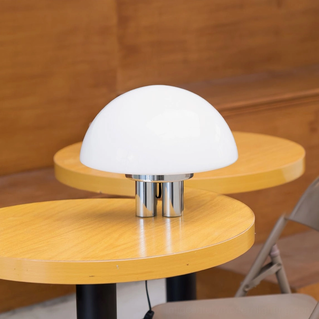 Pair of chrome mushroom lamps on round wooden cafe tables modern warm wood aesthetic