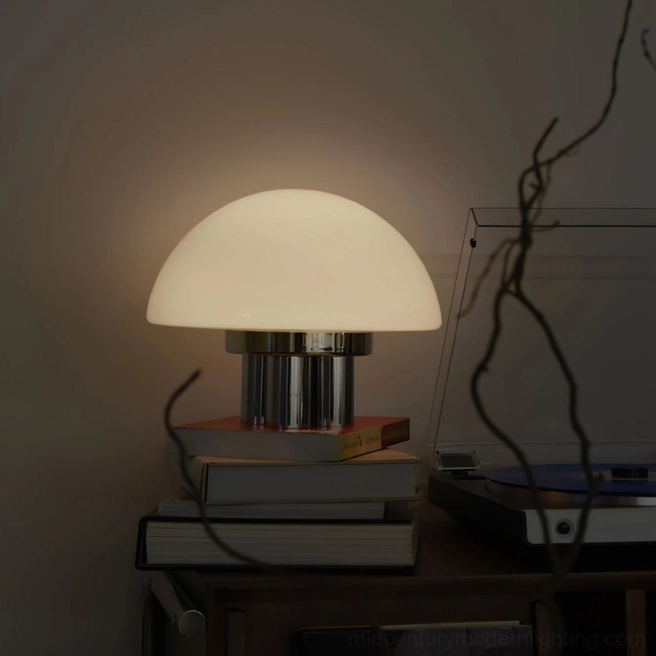 Magnolia mushroom table lamp reflecting light off polished chrome base luxury finish