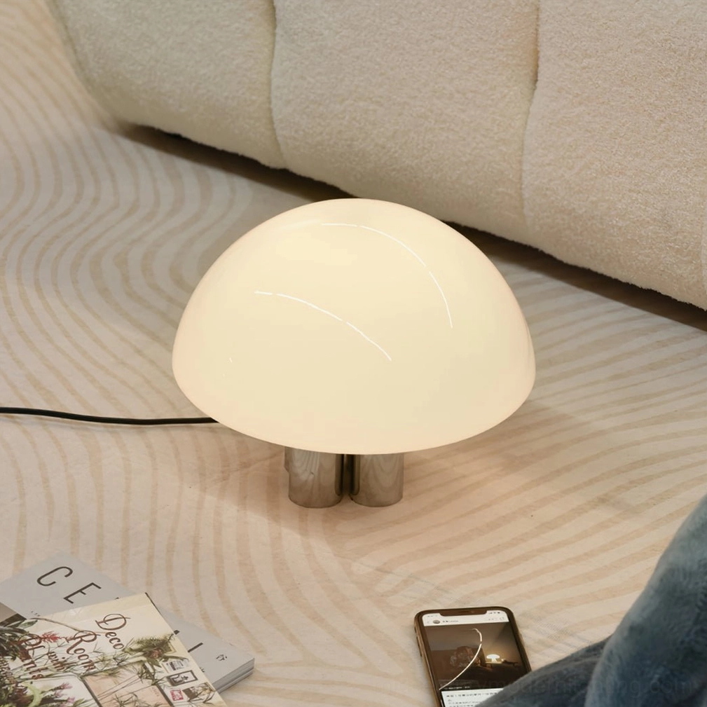 Contemporary mushroom table lamp providing task lighting for reading and workspace