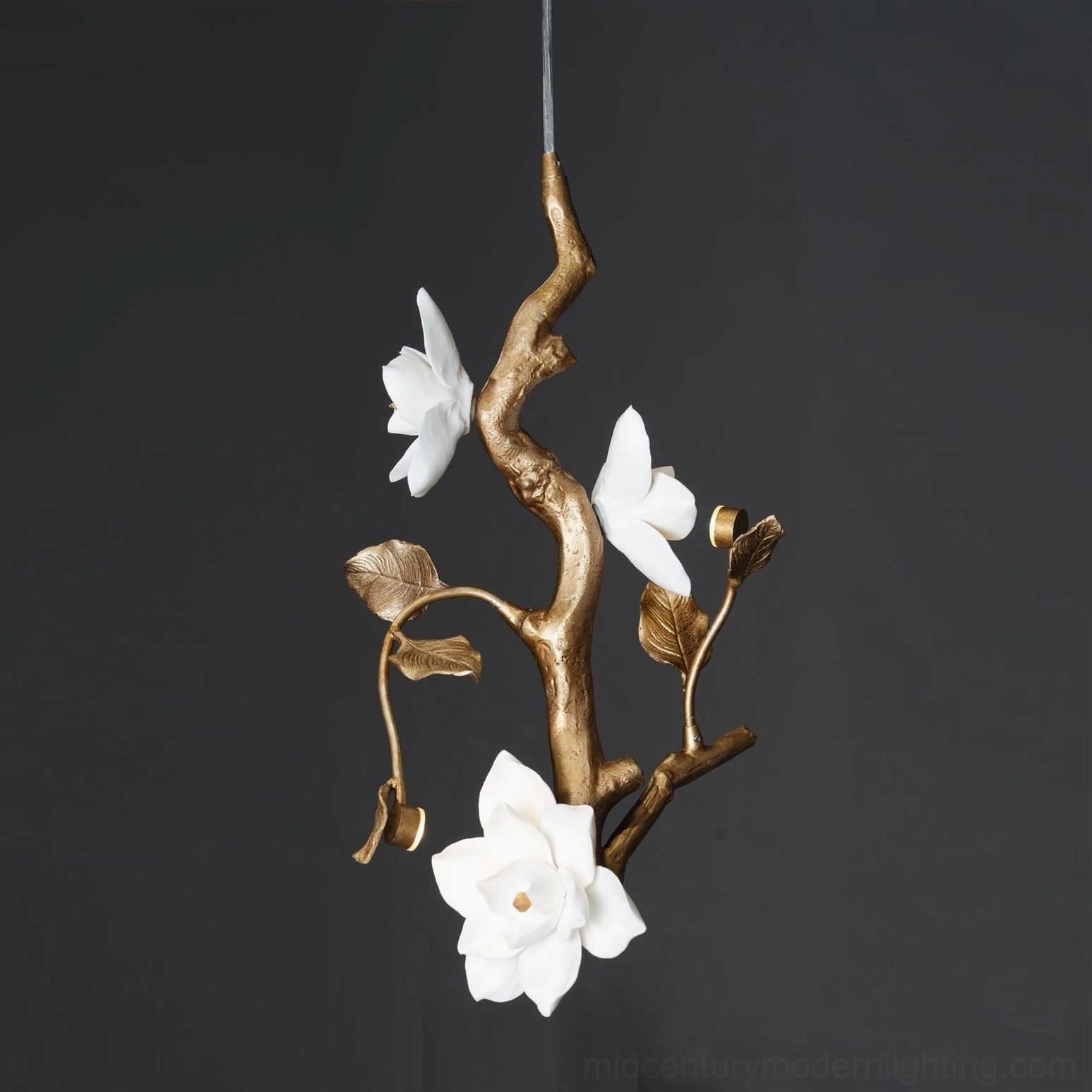 Three-quarter view of thylane magnolia flower pendant light highlighting three-dimensional floral form and brass frame