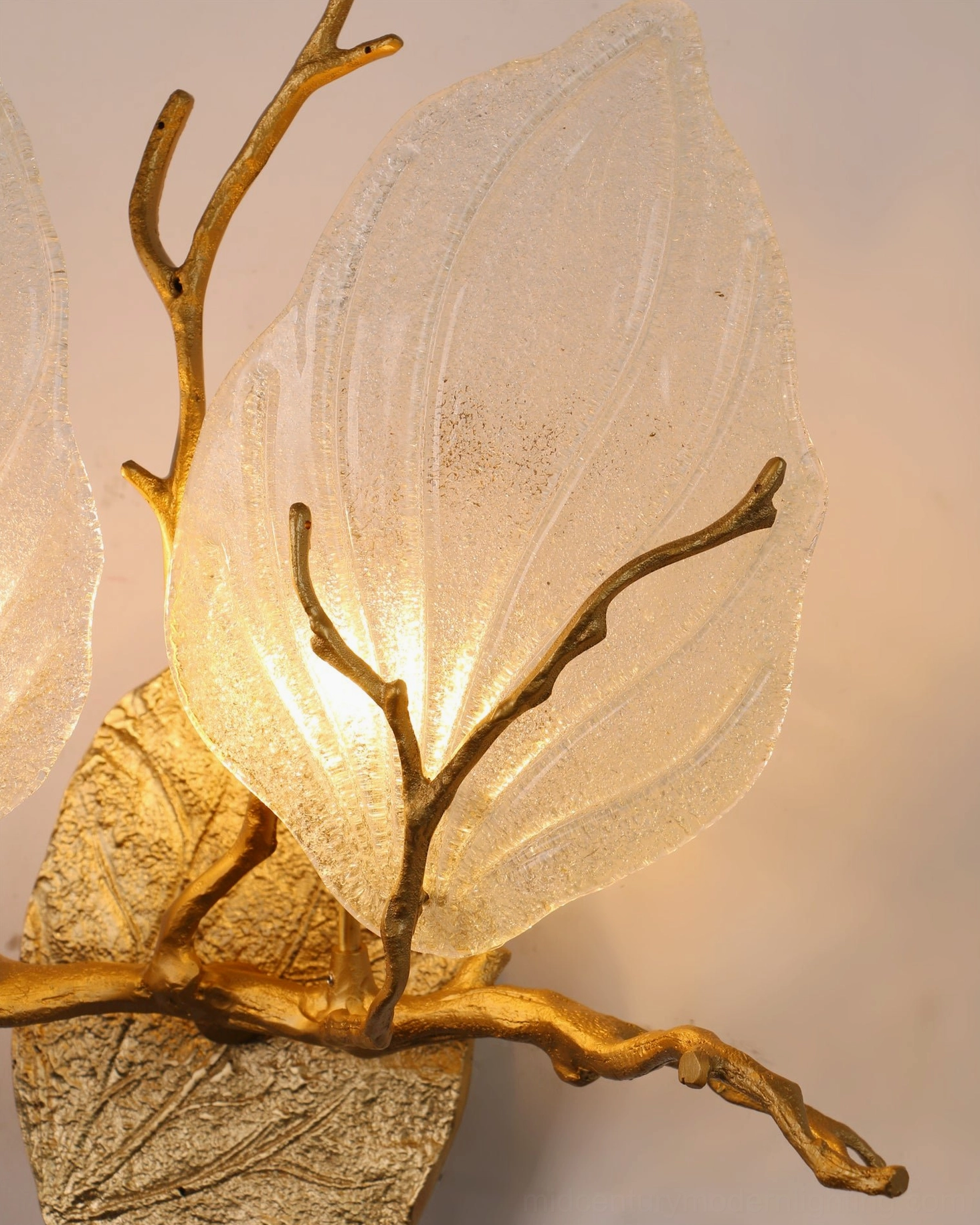 Magnolia leaf glass sconce in hallway space demonstrating low-profile horizontal mounting and ambient light diffusion