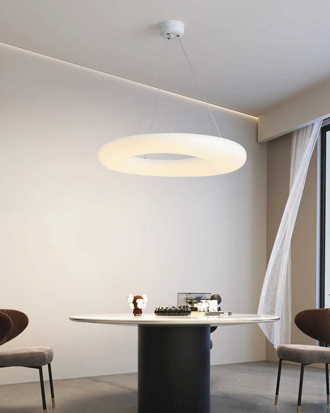 Magoo LED pendant light creating soft ambient glow in minimalist dining room