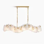 Mahina Cloud linear chandelier with brushed gold brass frame and marbled opaque glass cloud shades, front view studio photography