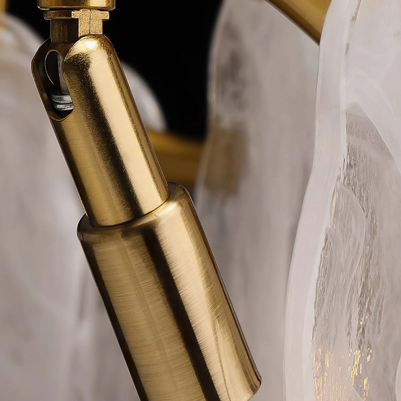 Chandelier mounting joint component in brushed brass finish showing adjustable installation hardware and professional-grade engineering
