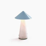Maisie cordless rechargeable LED table lamp with glossy blue cone shade and glowing tapered jade base on white background