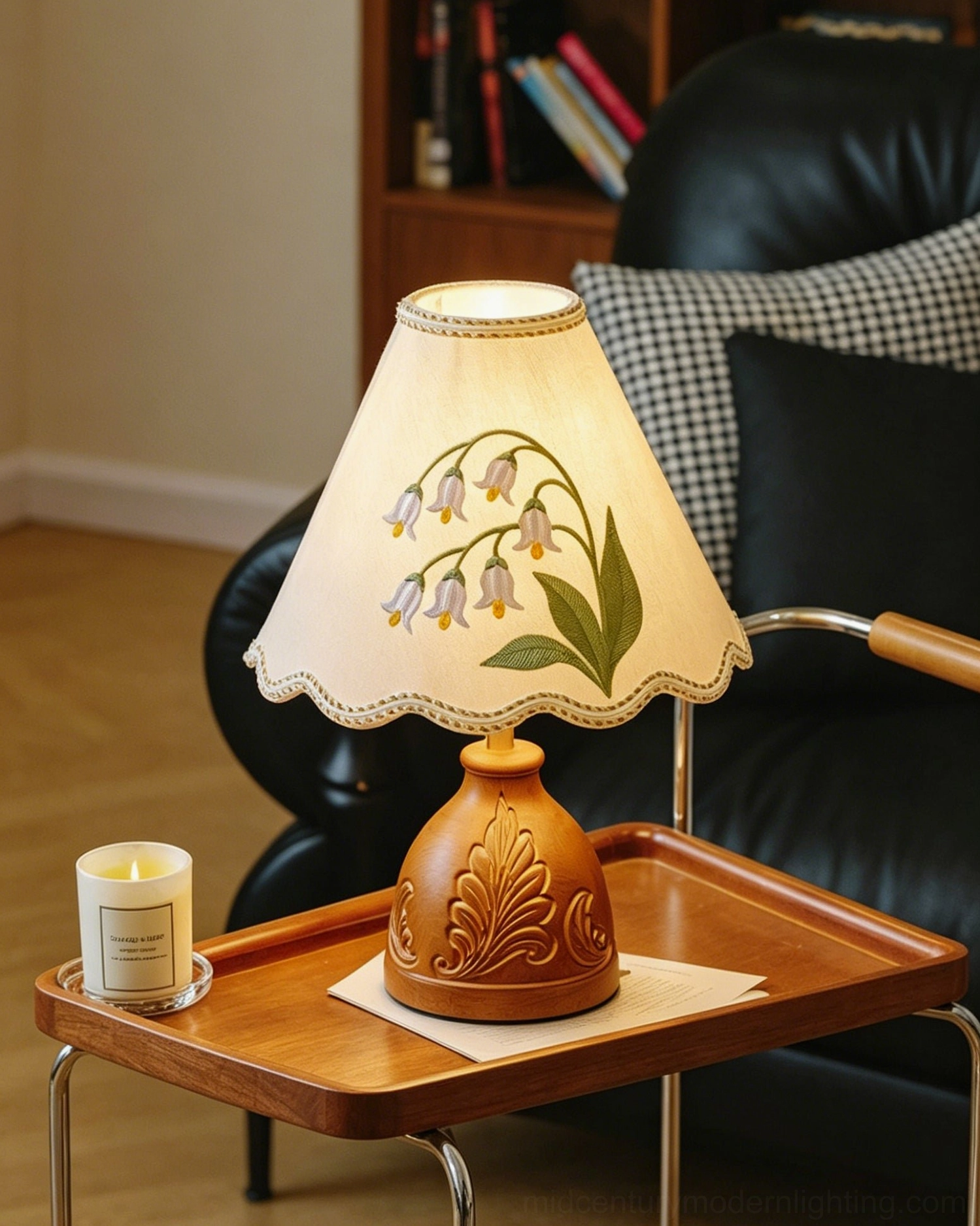 Full view of embroidered table lamp with walnut wood base and cream fabric shade with braided trim
