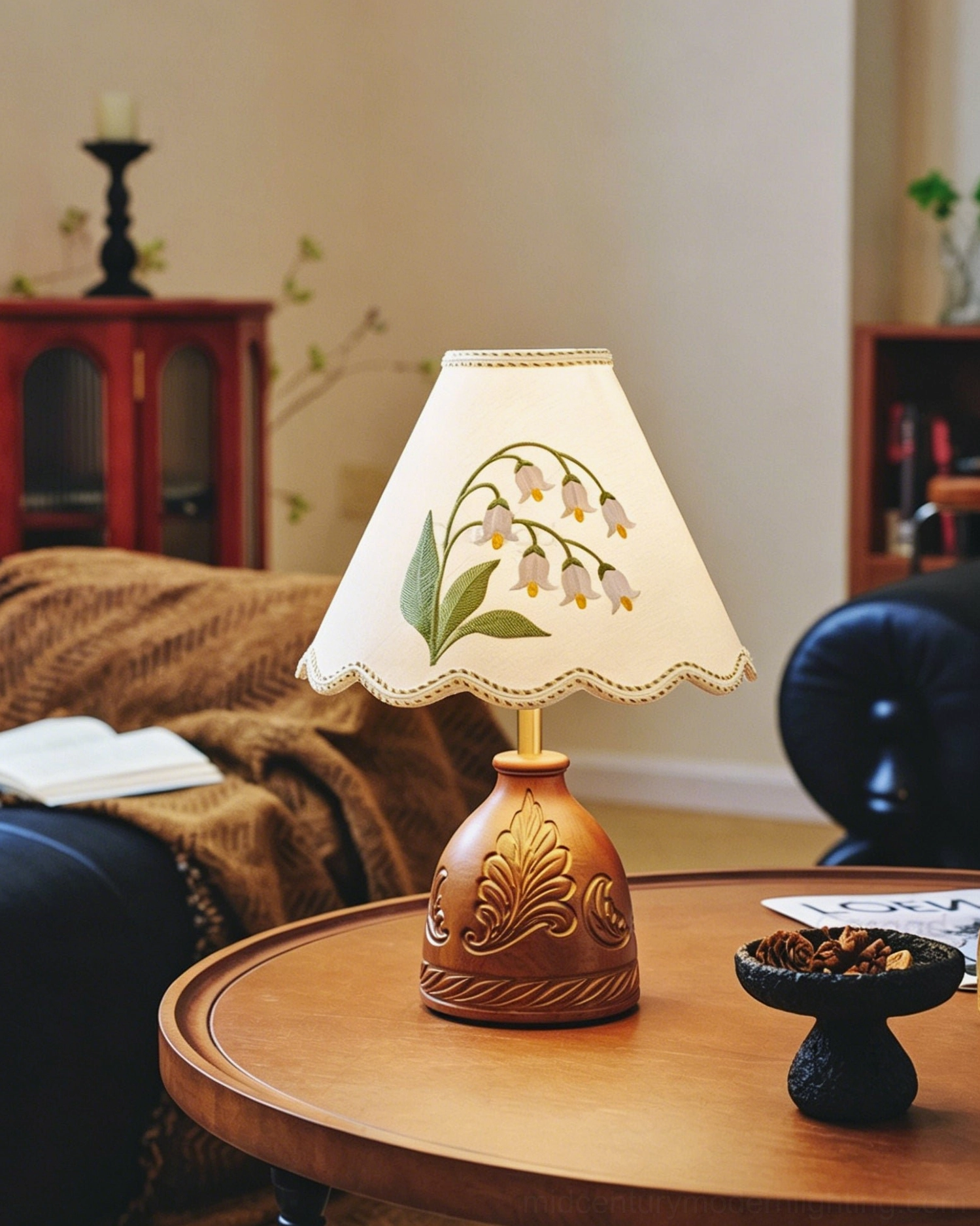 Cottage style table lamp with hand-embroidered botanical patterns on fabric shade and carved wooden base