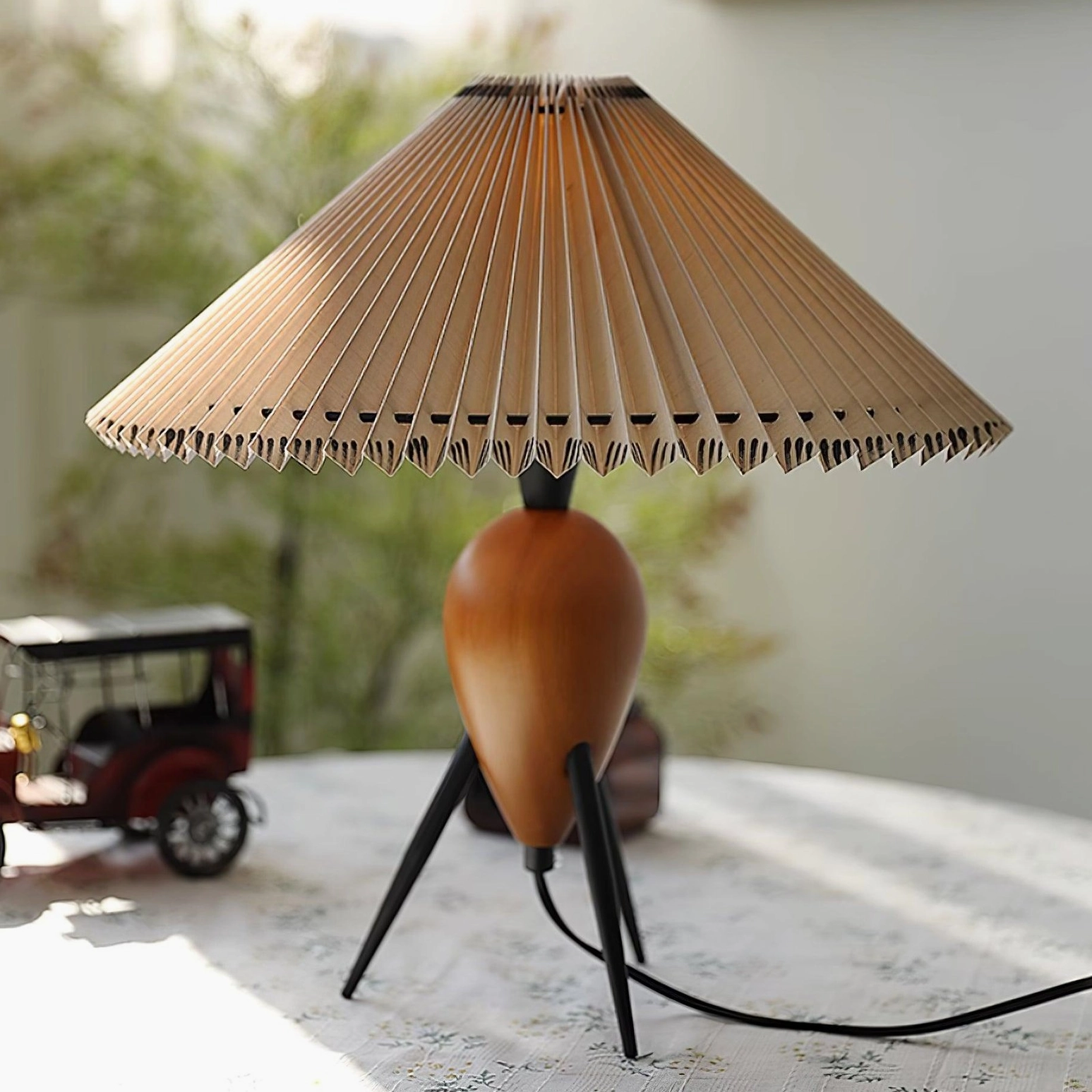 Makie pleated fabric shade close-up showing accordion fold texture and light diffusion