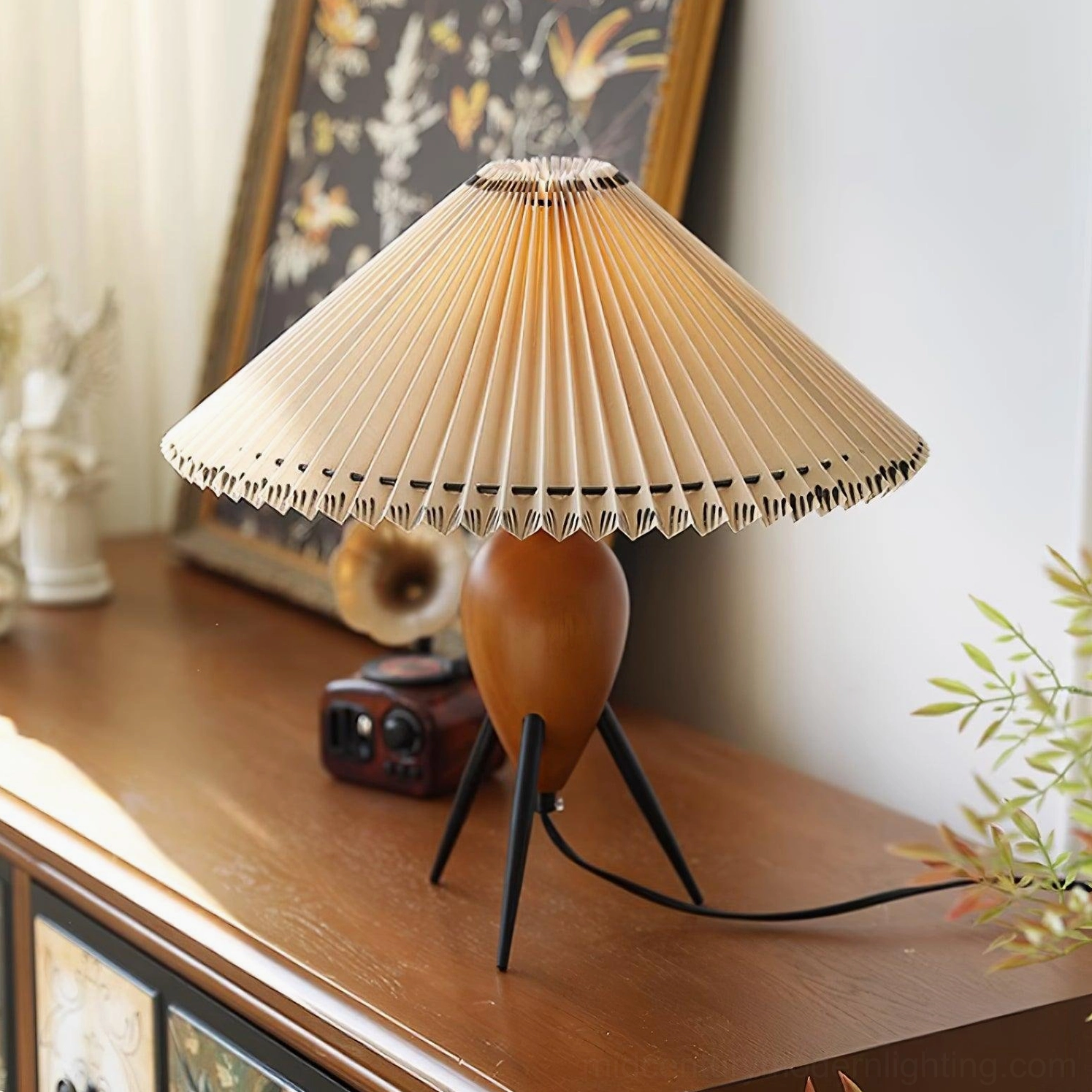 Makie mid-century tripod lamp styled in modern home interior setting with contemporary furnishings
