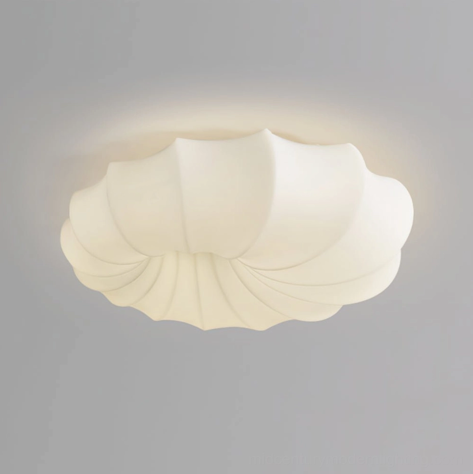 Close-up detail of malibu off-white flush mount lamp showing matte finish and fluted shell surface
