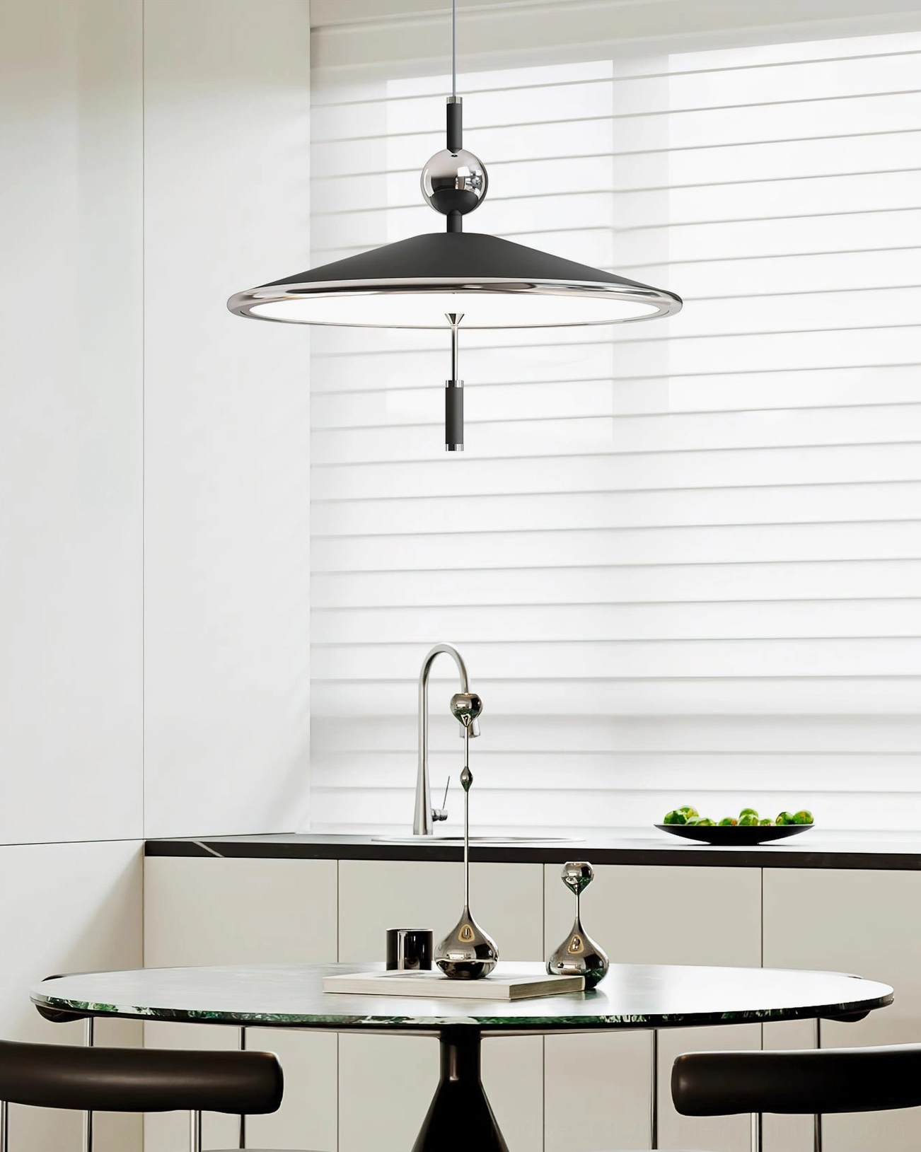 Malmo minimalist pendant fixture above glass dining table in modern kitchen nook with side angle view