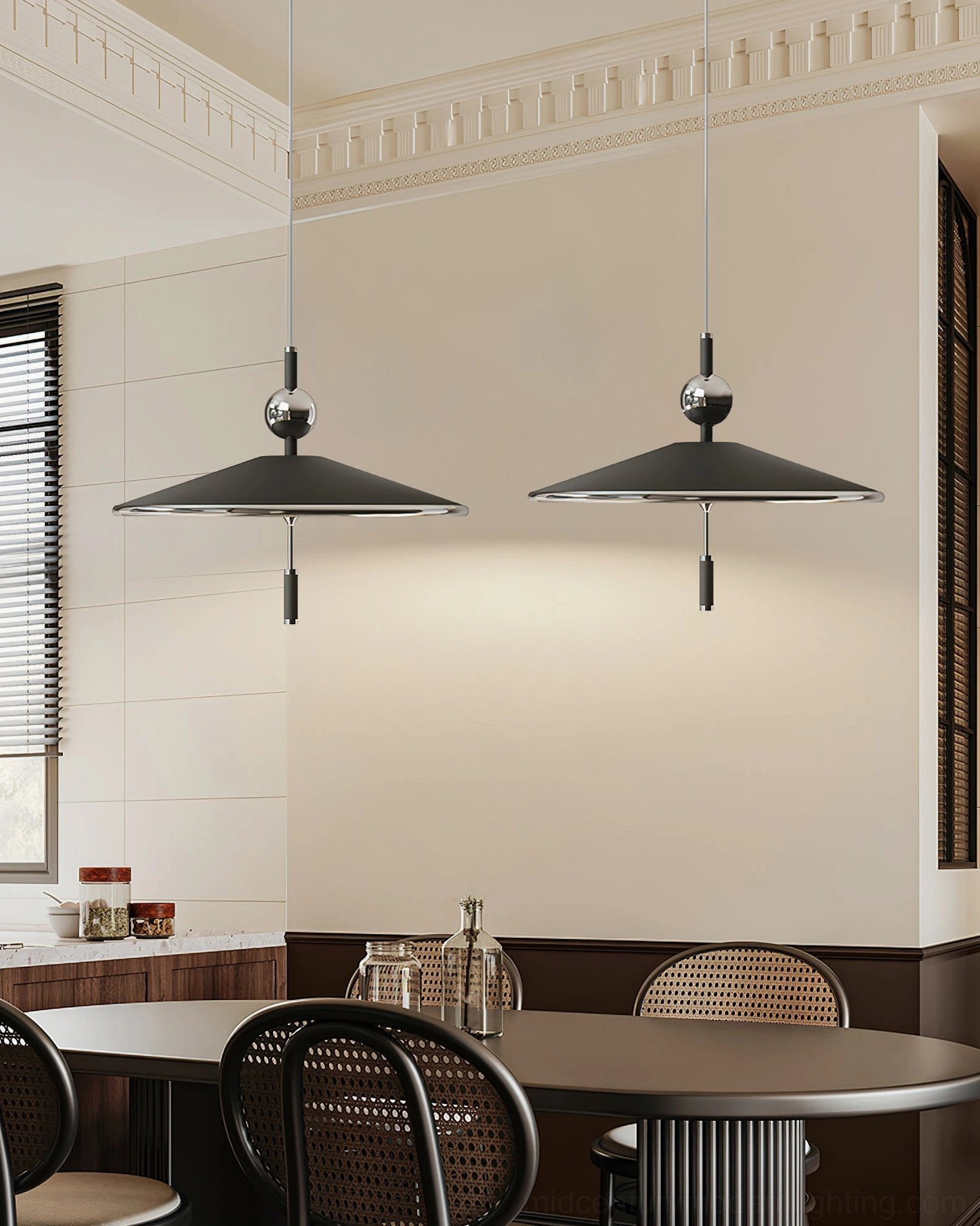 Twin Malmo pendant lights symmetrically suspended above round dining table in home dining room