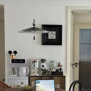 Malmo modern pendant light installed in contemporary kitchen coffee bar above stainless steel appliances