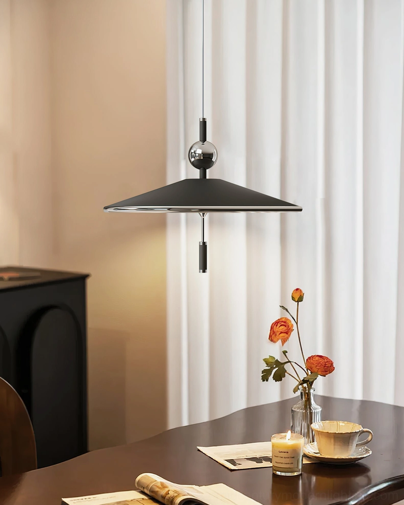 Malmo pendant light with warm LED glow paired with floral table centerpiece in modern dining workspace