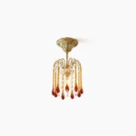 Maltose vintage brass gold ceiling light with amber and clear crystal glass pendants, direct front view studio photography